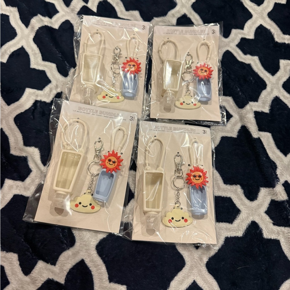 FOUR NEW WHITE LIP BALM HAND SANITIZER AND KEYCHAIN SET